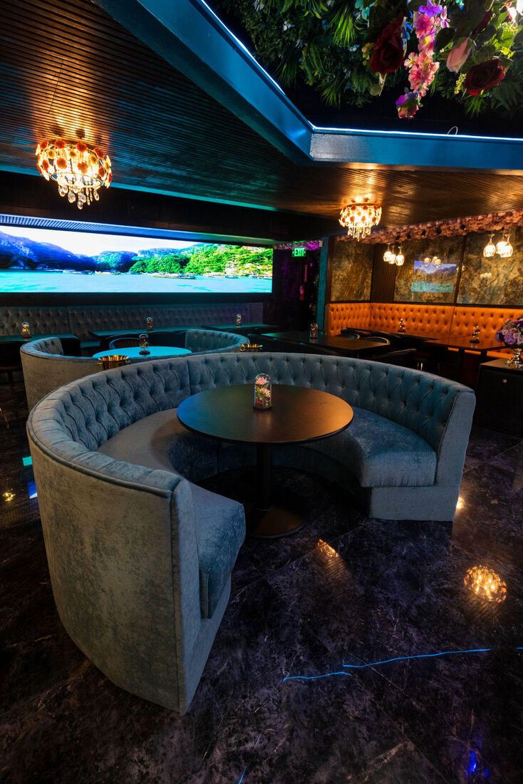 Round velvet booths in the lounge